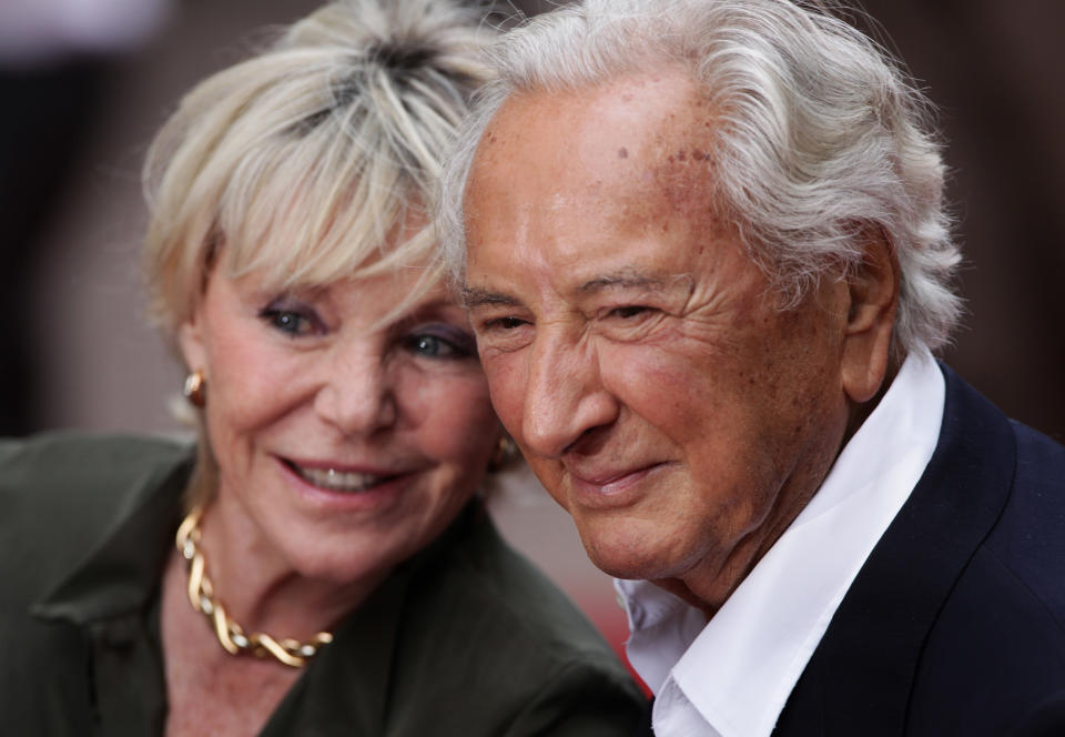 Michael Winner and Geraldine Lynton Edwards arriving for the UK premiere of The Expendables at the Odeon, Leicester Square, London.Picture date: Monday August 9, 2010.   (Photo by Yui Mok/PA Images via Getty Images)