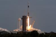 A SpaceX Falcon 9 rocket, carrying the Crew Dragon astronaut capsule, lifts off on an in-flight abort test from the Kennedy Space Center in Cape Canaveral