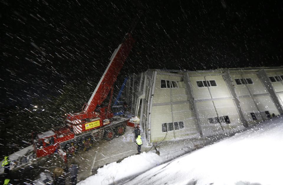 A collapsed resort building is seen amidst snow in Gyeongju