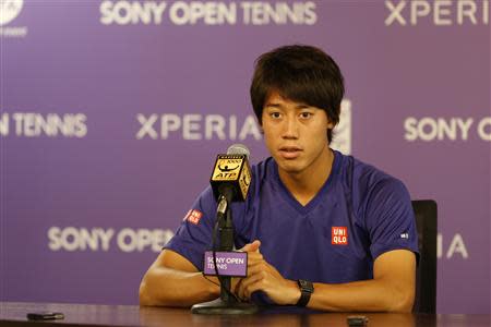 Mar 28, 2014; Miami, FL, USA; Kei Nishikori speaks at a press conference announcing his withdrawal from his match against Novak Djokovic (not pictured) in the men's singles semi final of the Sony Open at Crandon Tennis Center. Geoff Burke-USA TODAY Sports