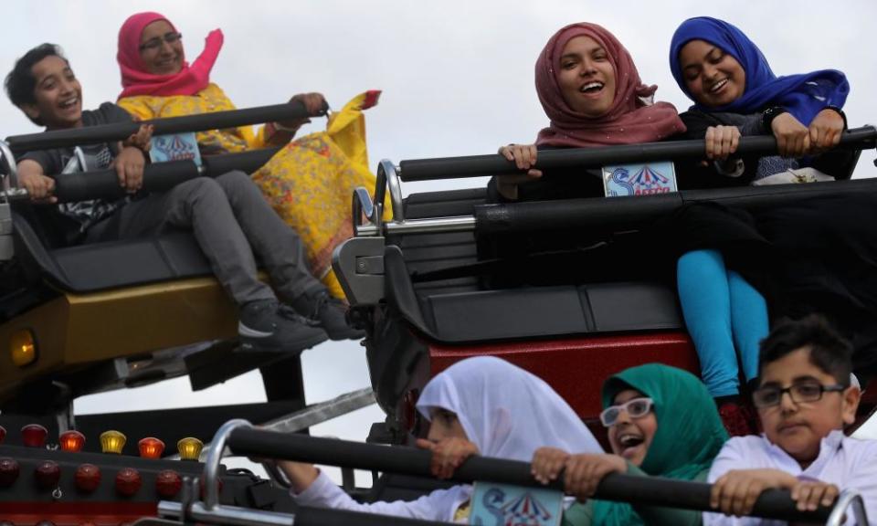 Fun-fair rides at the Eid festival in Small Heath Park, Birmingham.