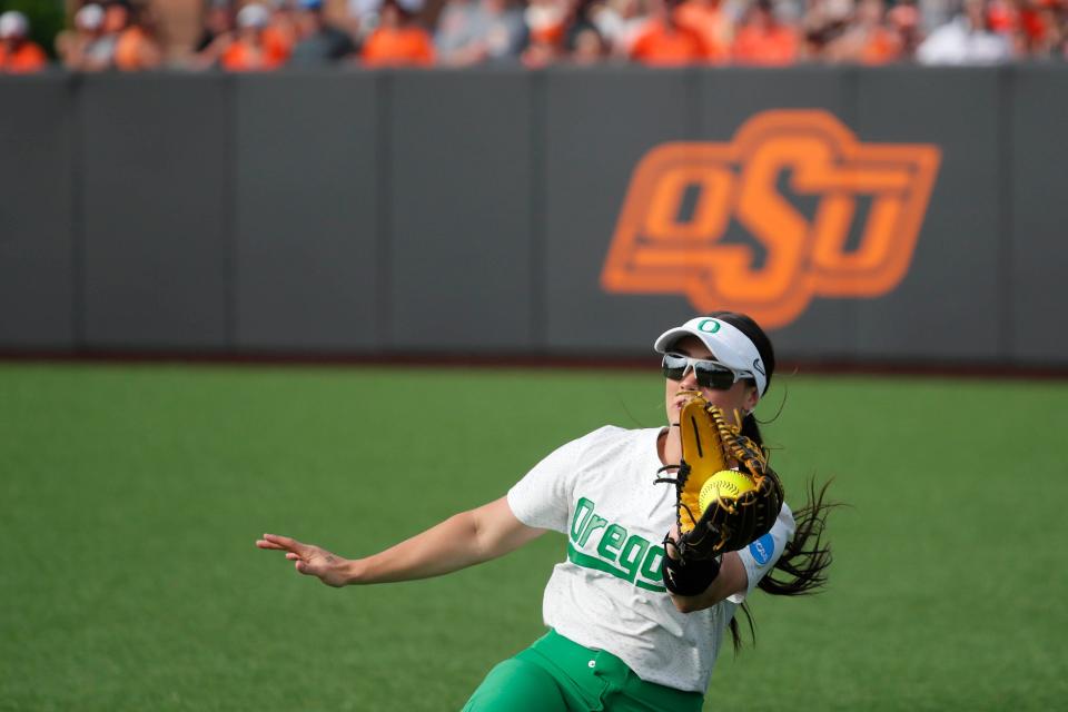 Oregon's Ariel Carlson (3) catches the ball for an out in the third inning of the second game between the Oklahoma State Cowgirls (OSU) and the Oregon Ducks in the Stillwater Super Regional of the NCAA softball tournament in Stillwater, Okla., Friday, May 26, 2023.