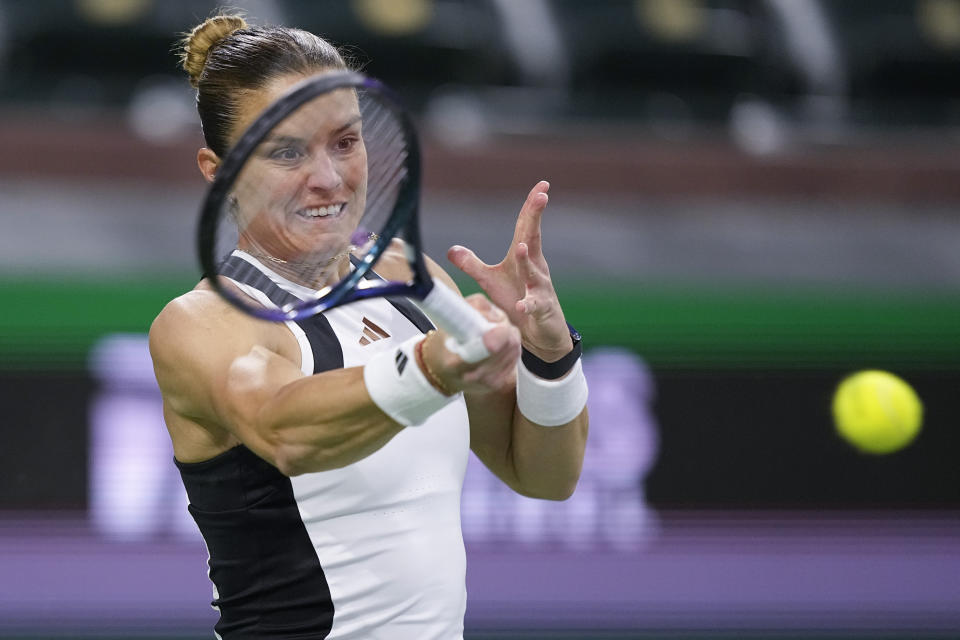 Maria Sakkari, of Greece, returns to Emma Navarro, of the United States, during a quarterfinal match at the BNP Paribas Open tennis tournament, Thursday, March 14, 2024, in Indian Wells, Calif. (AP Photo/Mark J. Terrill)