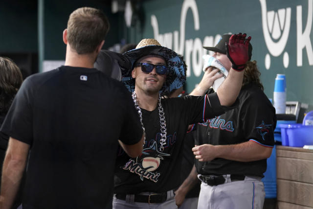 Rangers rally from 5-0 deficit to beat Marlins 9-8