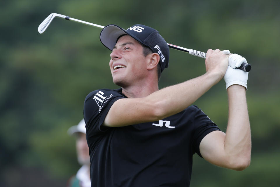 Viktor Hovland, of Norway, watches his tee shot on the 18th hole during the second round of A Military Tribute at The Greenbrier golf tournament in White Sulphur Springs, W.Va., Friday, Sept. 13, 2019. (AP Photo/Steve Helber)