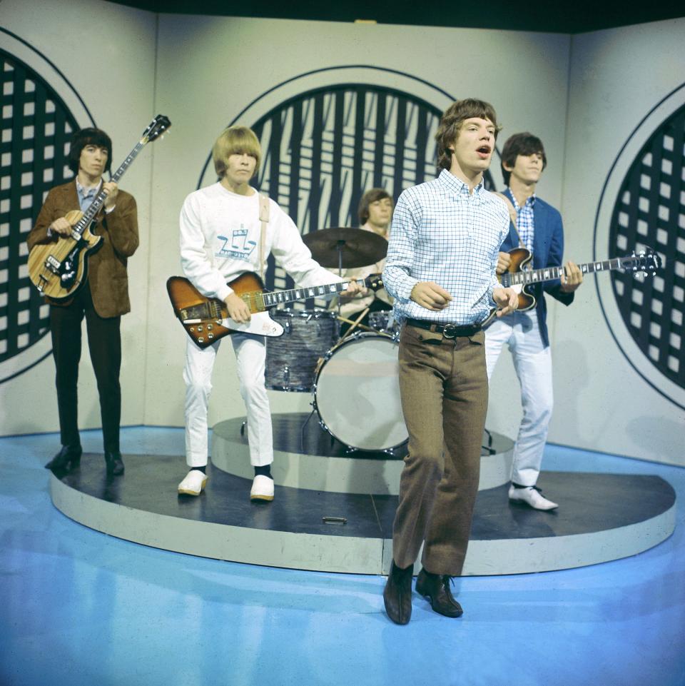 English rock group The Rolling Stones perform on the set of the ABC Television pop music television show Thank Your Lucky Stars at Alpha Television Studios in Birmingham, England on 30th January 1965. The band would play three songs on the show, Down Home Girl, Under the Boardwalk and Susie Q. Members of the group are, from left, Bill Wyman, Brian Jones (playing Gibson Firebird guitar), Charlie Watts, Mick Jagger and Keith Richards (playing Epiphone guitar). (Photo by David Redfern/Redferns)