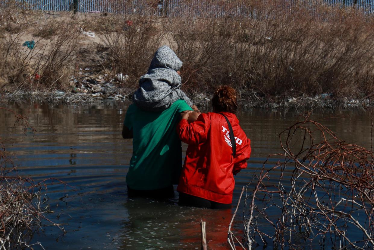 <span>Migrants attempt to cross the Rio Grande toward the US on 19 February in Ciuaded Juarez, Mexico.</span><span>Photograph: Anadolu/Getty Images</span>