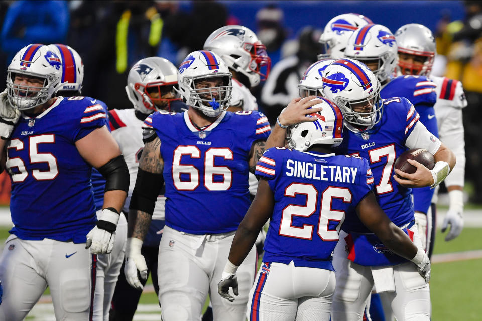 Buffalo Bills quarterback Josh Allen, right, hugs Devin Singletary during the second half of an NFL football game Sunday, Nov. 1, 2020, in Orchard Park, N.Y. The Bills won 24-21. (AP Photo/Adrian Kraus)