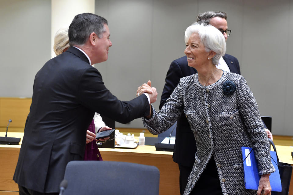 European Central Bank President Christine Lagarde, right, shakes hands with President of the Eurogroup Paschal Donohoe during a round table meeting at an EU summit in Brussels, Friday, March 24, 2023. European leaders gather Friday to discuss economic and financial challenges and banking rules, seeking to tamp down concerns about eventual risks for European consumers from banking troubles in the US and Switzerland. (AP Photo/Geert Vanden Wijngaert)