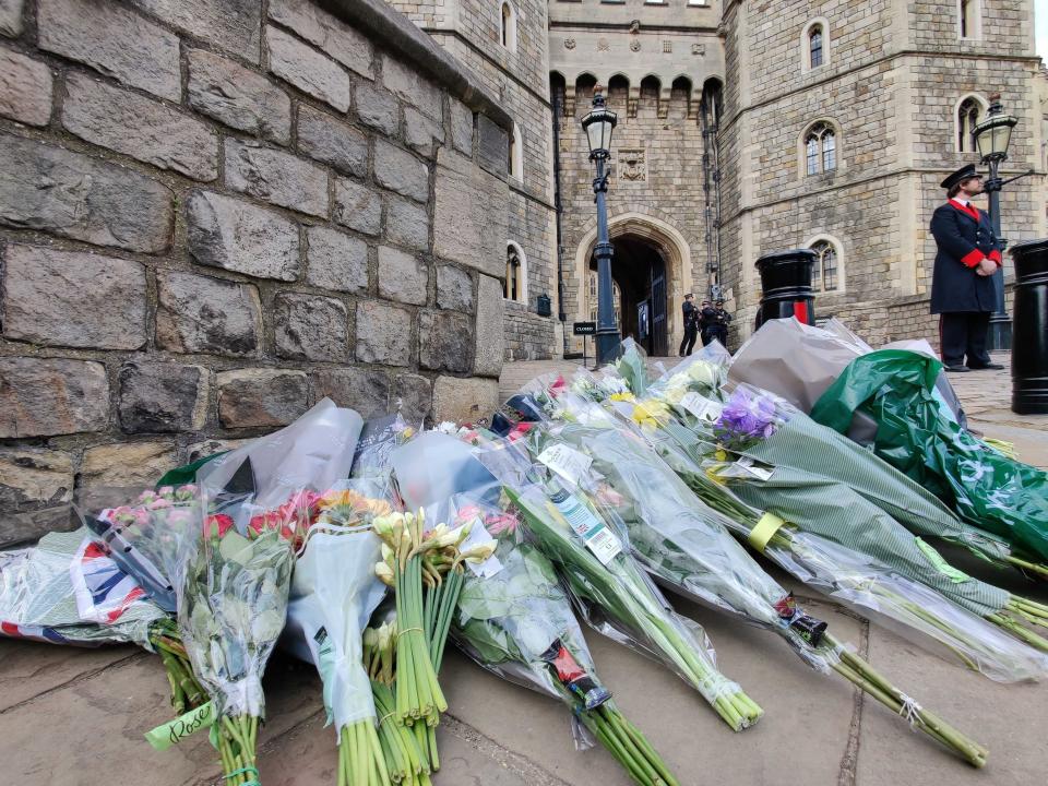 Flowers are pictured outside Windsor Castle after the death of Prince Philip was announced on 9 April, 2021.Tom Richell