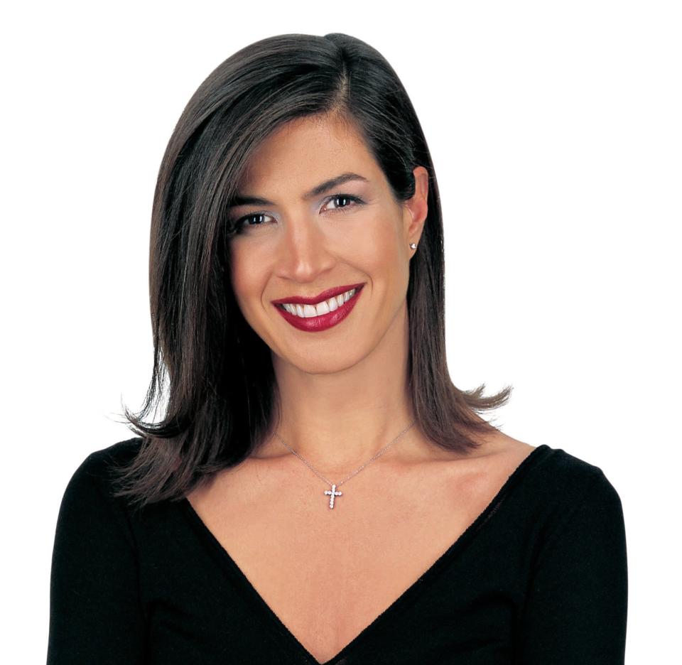 A publicity photo of Hildi Santo-Tomas smiling at the camera 
