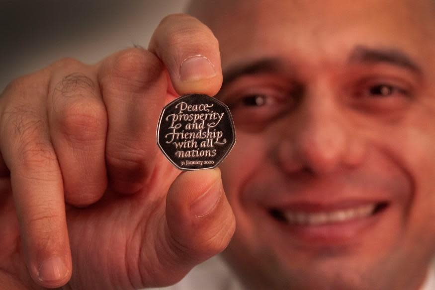 Sajid Javid holding the Brexit coin: PA