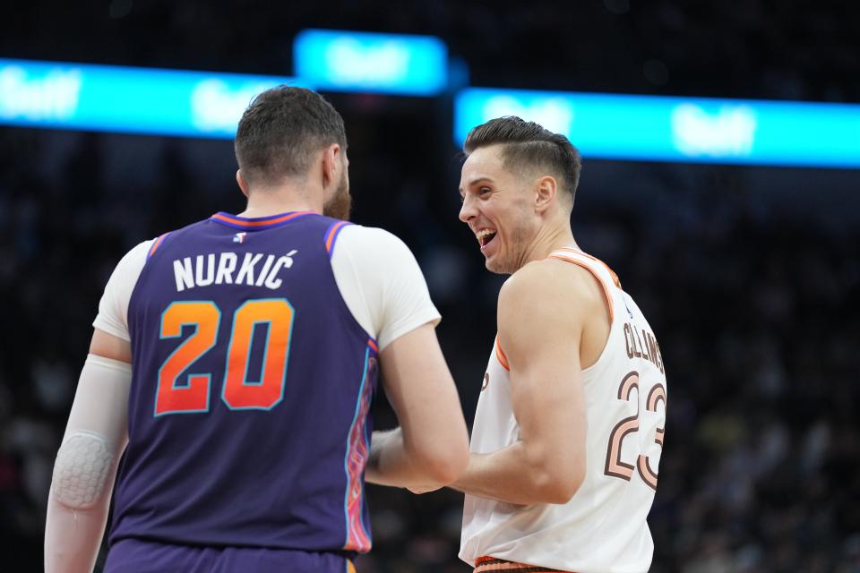 San Antonio Spurs forward Zach Collins (23) talks with Phoenix Suns center Jusuf Nurkic (20) in the first half at Frost Bank Center.