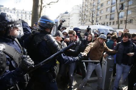 French police clash with French high school and university students during a demonstration against the French labour law proposal in Paris, France, April 5, 2016 as the French Parliament will start to examine the contested reform bill. REUTERS/Pascal Rossignol