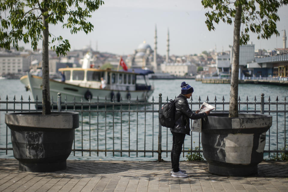 A man reads a Turkish a newspaper a day after the presidential election day, in Istanbul, Turkey, Monday, May 15, 2023. Turkey's presidential elections appeared to be heading toward a second-round runoff on Monday, with President Recep Tayyip Erdogan, who has ruled his country with a firm grip for 20 years, leading over his chief challenger, but falling short of the votes needed for an outright win. (AP Photo/Emrah Gurel)