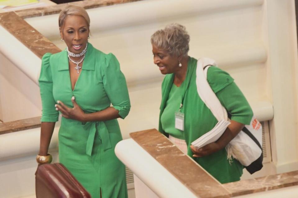 Two women in green