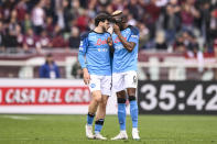 Napoli's Khvicha Kvaratskhelia, left, celebrates with Viktor Osimhen after scoring his side's 2nd goal during the Serie A soccer match between Torino and Napoli at the Turin Olympic stadium, Italy, Sunday, March 19, 2023. (Fabio Ferrari/LaPresse via AP)