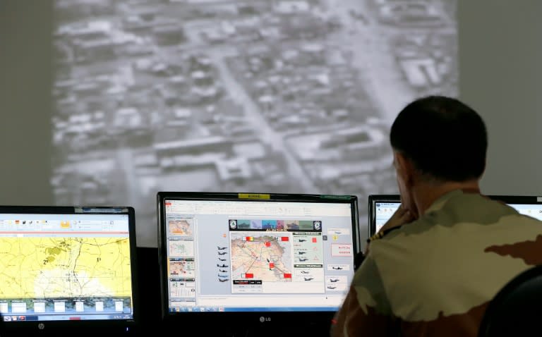 A French soldier sits in a control room at a French military base at an undisclosed location in the Gulf on November 17, 2015, as he monitors operations against the Islamic State group in Syria and Iraq