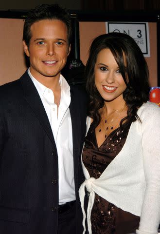 <p>John Sciulli/WireImage</p> Scott Wolf and Lacey Chabert at a red carpet event