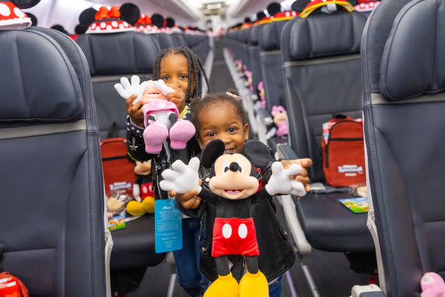 <p>Ingrid Barrentine/Alaska Airlines</p> Kids on “Mickey’s Toontown Express" plane