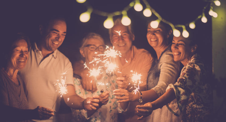 People holding sparkler celebrating 