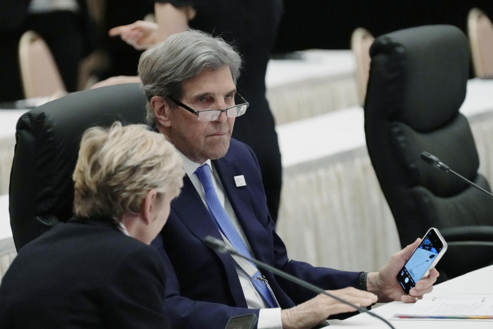 U.S. Secretary of Energy Jennifer Granholm, left, and U.S. Special Presidential Envoy for Climate John Kerry talk before a plenary session started in the G-7 ministers' meeting on climate, energy and environment in Sapporo, northern Japan, Saturday, April 15, 2023. (AP Photo/Hiro Komae)