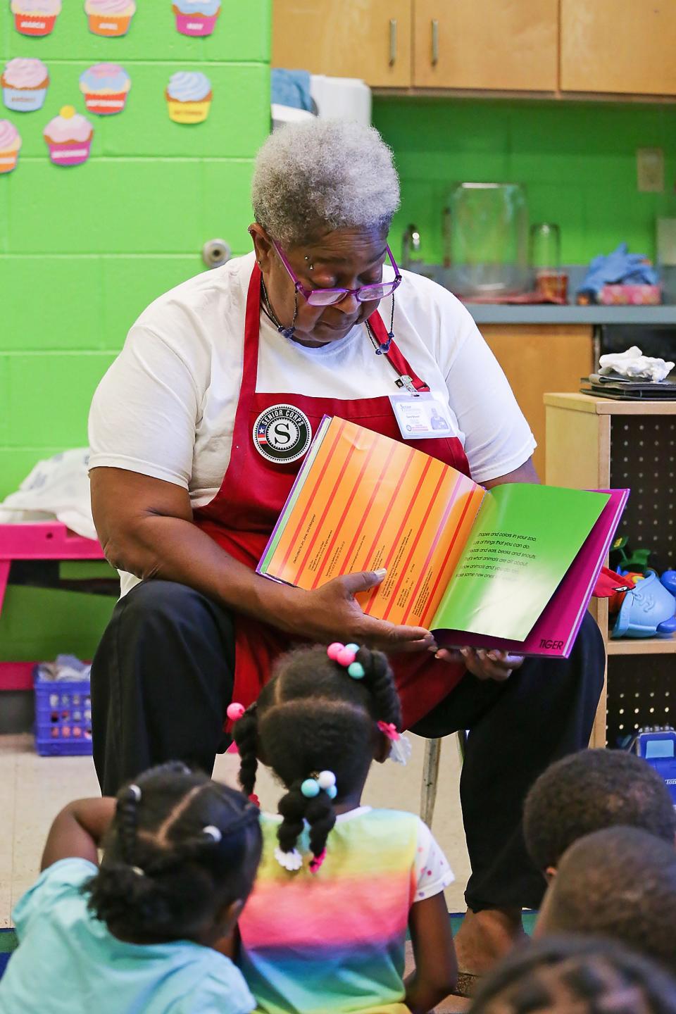 An AmericaCorps Senior Foster Grandparent reads to students in this undated photo. Central Missouri Community Action coordinates the program locally and is need of more volunteers.