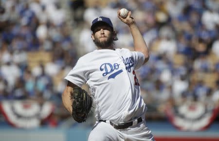 Oct 17, 2018; Los Angeles, CA, USA; Los Angeles Dodgers starting pitcher Clayton Kershaw (22) pitches in the first inning game five of the 2018 NLCS playoff baseball series against the Milwaukee Brewers at Dodger Stadium. Mandatory Credit: Jae C. Hong/Pool Photo via USA TODAY Sports