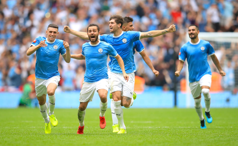 Manchester City players celebrate after winning the penalty shootout in the Community Shield match at Wembley Stadium, London. (Photo by Adam Davy/PA Images via Getty Images)