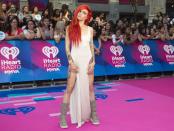 <p>The Canadian songstress showed a whole lotta leg in a long white gown with double thigh-high slits, which totally showcased her tattoos. She kept the look rocker-approved by adding mid-calf boots. </p>