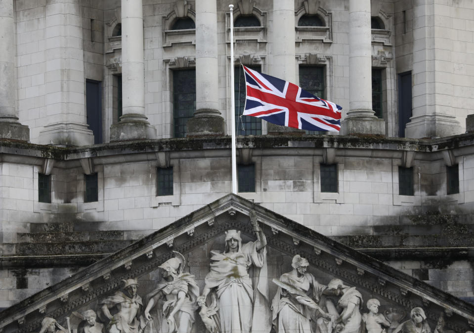 Flags fly at half-staff on City Hall in Belfast, Northern Ireland, Friday, April 9, 2021 in respect of Britain's Prince Philip who died earlier in the day. Prince Philip, the irascible and tough-minded husband of Queen Elizabeth II who spent more than seven decades supporting his wife in a role that both defined and constricted his life, has died, Buckingham Palace said Friday. He was 99. (AP Photo/Peter Morrison)