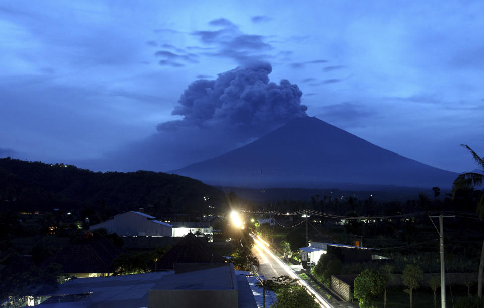 <p>A view of Mount Agung volcano erupting in Karangasem, Bali, Indonesia, Nov. 28, 2017. Indonesia authorities raised the alert for the rumbling volcano to highest level on Monday and closed the international airport on tourist island of Bali stranding thousands of travelers. (Photo: Firdia Lisnawati/AP) </p>