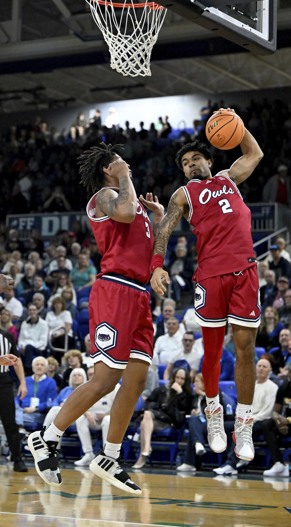 Florida Atlantic's Nick Boyd (2) comes down with with a rebound against Florida Gulf Coast in the first half of an NCAA college basketball game, Saturday, Dec. 30, 2023, in Fort Myers, Fla. (AP Photo/Chris Tilley)