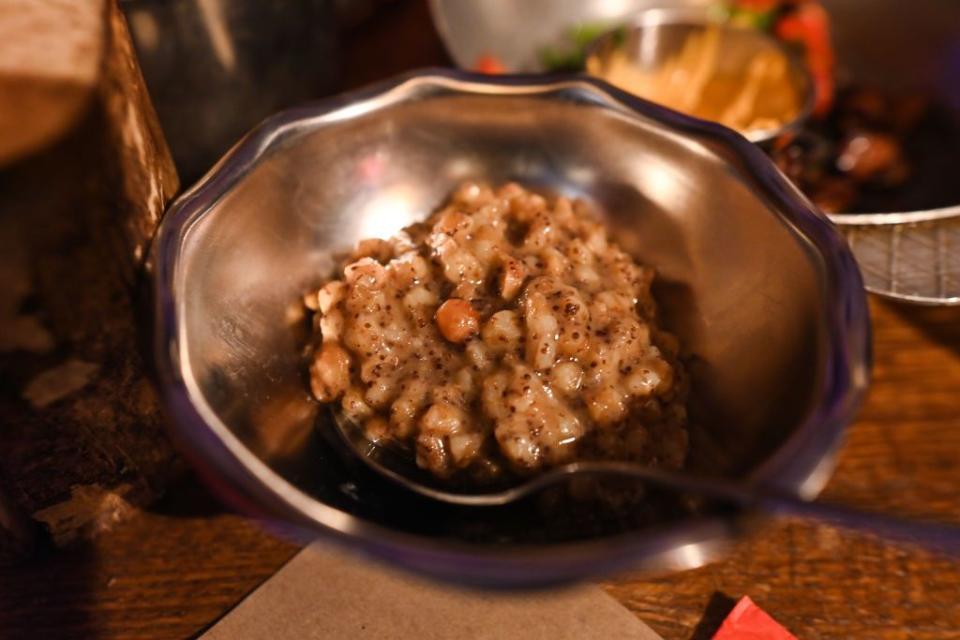 A plate with the 'Kutya' - a ceremonial grain dish traditionally served by Eastern Orthodox Christians, seen in the 'Kryivka' Ukrainian restaurant on Orthodox Christmas Eve, in Lviv, Ukraine, on Jan. 6, 2023. (Artur Widak/Anadolu Agency via Getty Images)