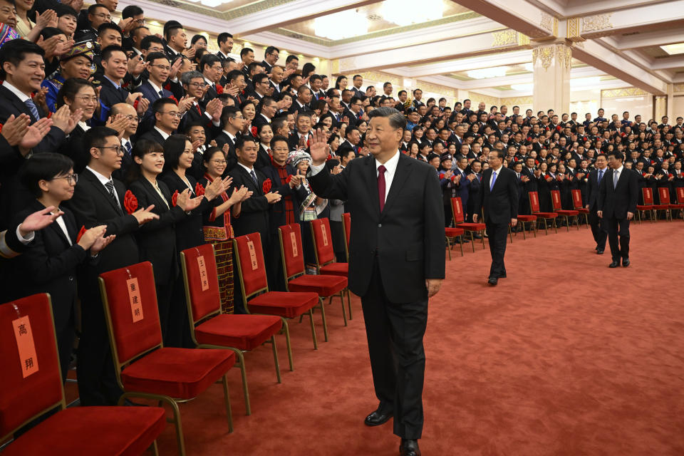 FILE - In this photo released by Xinhua News Agency, Chinese President Xi Jinping, center, and his premier Li Keqiang, center right, meet with representatives of model civil servants during a national award ceremony held at the Great Hall of the People in Beijing on Aug. 30, 2022. Chinese President Xi Jinping's first trip overseas since the early days of the COVID-19 pandemic will overlap with a visit by Pope Francis to Kazakhstan, although the Vatican says there are no plans for them to meet. (Li Xueren/Xinhua via AP, File)