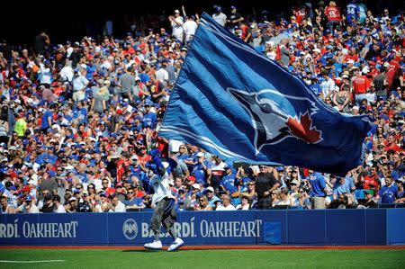 Aug 30, 2015; Toronto, Ontario, CAN; Toronto Blue Jays mascot Ace waves the Blue Jays flag before eighth inning against Detroit Tigers at Rogers Centre. Mandatory Credit: Peter Llewellyn-USA TODAY Sports