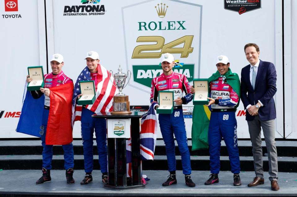 daytona, fl january 29 the 60 meyer shank racing w curb agajanian acura arx 06 team of tom blomqvist, colin braun, helio castroneves, and simon pagenaud celebrate with rolex watches awarded to the winners of the imsa rolex 24 at daytona on january 29, 2023 at daytona international speedway in daytona beach, fl photo by david rosenblumicon sportswire via getty images