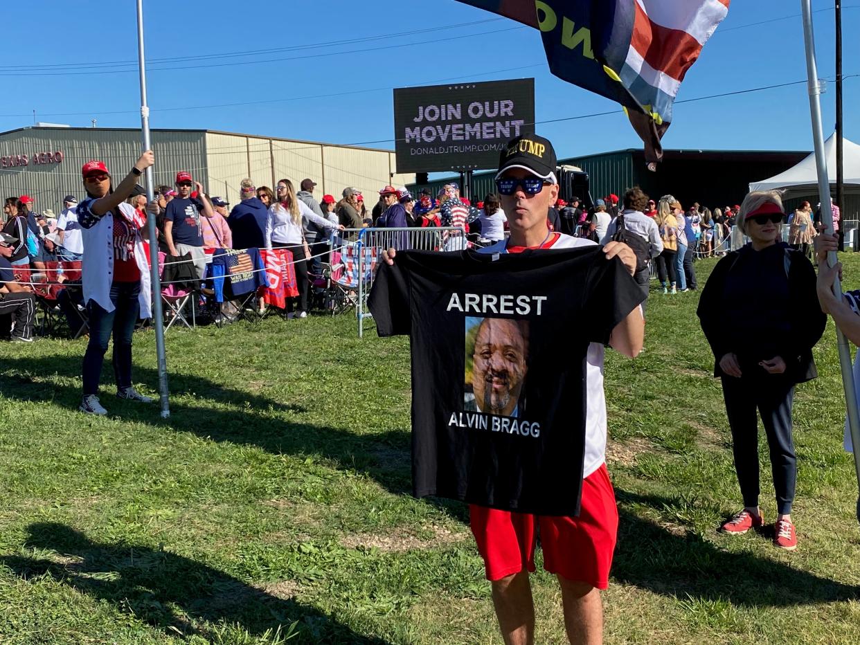 Man holds an ‘arrest Alvin Bragg’ t-shirt at the Trump rally in Waco, Texas (Josh Marcus)