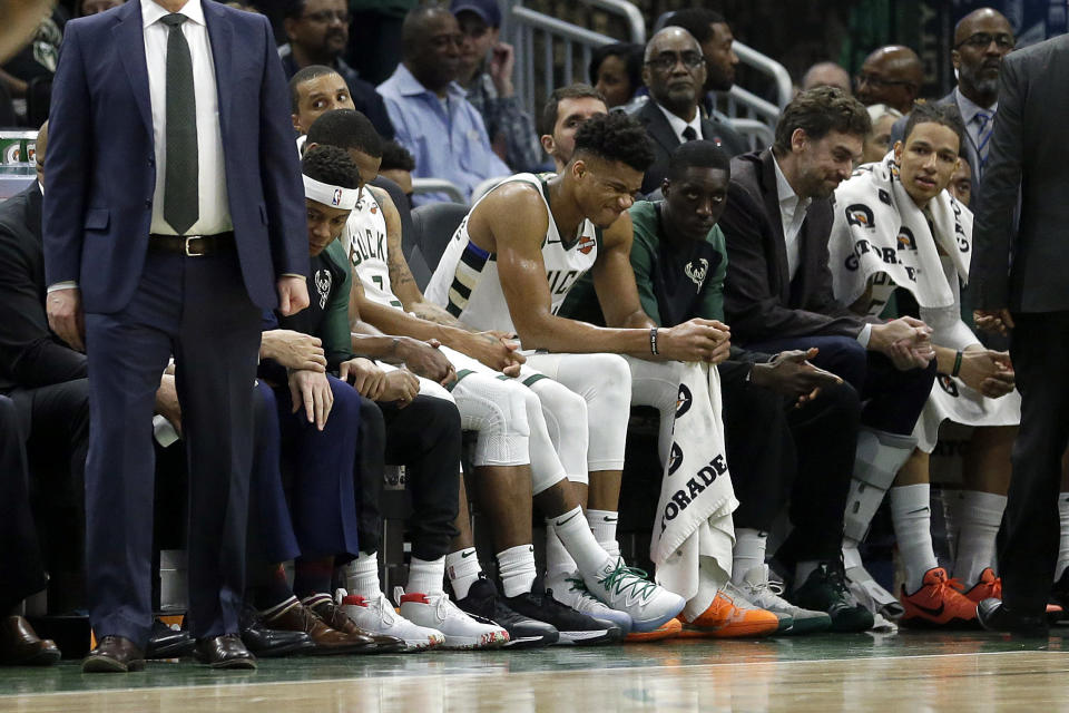 Milwaukee Bucks' Giannis Antetokounmpo grimaces from the bench during the second half of an NBA basketball game against the LA Clippers Thursday, March 28, 2019, in Milwaukee. Antetokounmpo exited the game after injuring his leg and did not return. The Bucks won 128-118. (AP Photo/Aaron Gash)