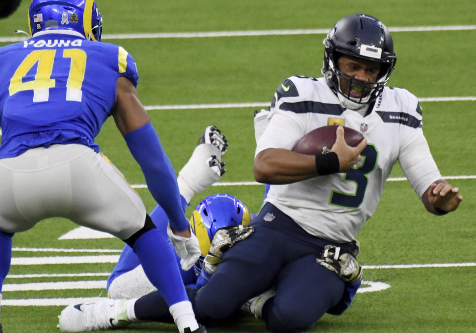 Seattle Seahawks quarterback Russell Wilson (3) scrambles against the Los Angeles Rams in the fourth quarter of an NFL football game in Inglewood, Calif., Sunday, Nov. 15, 2020. (Keith Birmingham/The Orange County Register via AP)