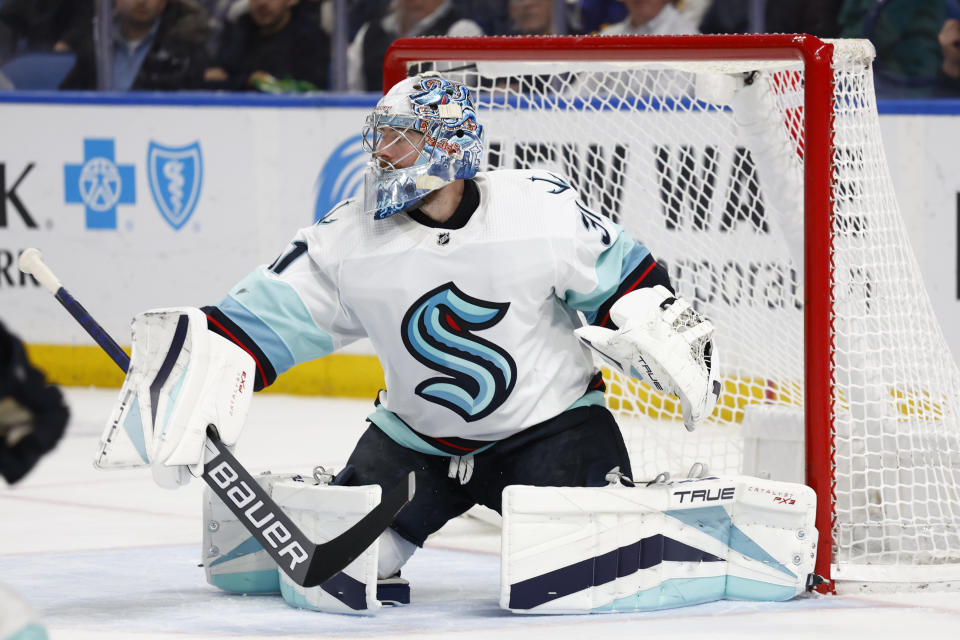 Seattle Kraken goaltender Philipp Grubauer (31) makes a pad save during the first period of an NHL hockey game against the Buffalo Sabres, Tuesday, Jan. 10, 2023, in Buffalo, N.Y. (AP Photo/Jeffrey T. Barnes)