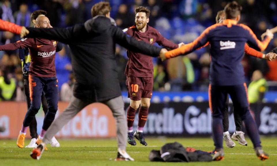 Barcelona’s Lionel Messi celebrates with the squad after winning the league title.