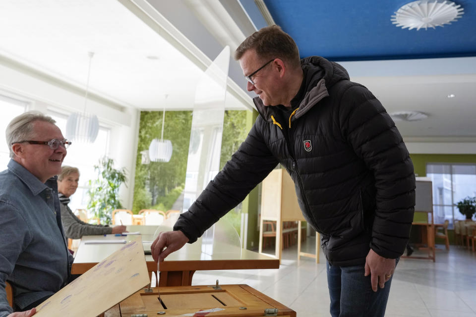 Chairman of the National Coalition Party Petteri Orpo casts his ballot at a polling station during parliamentary election in Turku, Finland, Sunday, April 2, 2023. (AP Photo/Sergei Grits)