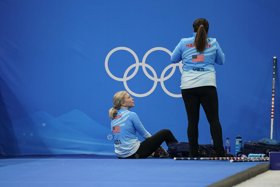 United States' Nina Roth, left, and United States' Rebecca Hamilton, right, prepare to leave after a win against the Russian Olympic Committee during a women's curling match at the Beijing Winter Olympics Thursday, Feb. 10, 2022, in Beijing. (AP Photo/Brynn Anderson)