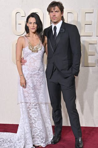 <p>Axelle/Bauer-Griffin/FilmMagic</p> Riley Keough and Ben Smith-Petersen attend the 81st Annual Golden Globe Awards on January 07, 2024 in Beverly Hills, California.