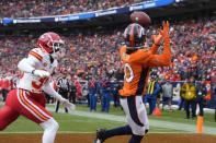 Denver Broncos wide receiver Jerry Jeudy (10) catches a touchdown pass as Kansas City Chiefs cornerback Jaylen Watson defends during the first half of an NFL football game Sunday, Oct. 29, 2023, in Denver. (AP Photo/David Zalubowski)