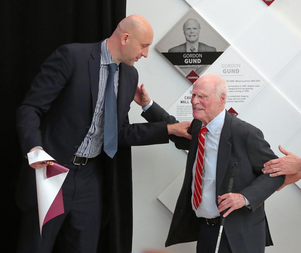 Zydrunas Ilgauskas, left, shares a moment with former owner Gordon Gund during the Wall of Honor ceremony at Rocket Mortgage FieldHouse, Saturday, March 26, 2022, in Cleveland, Ohio. [Jeff Lange/Beacon Journal]