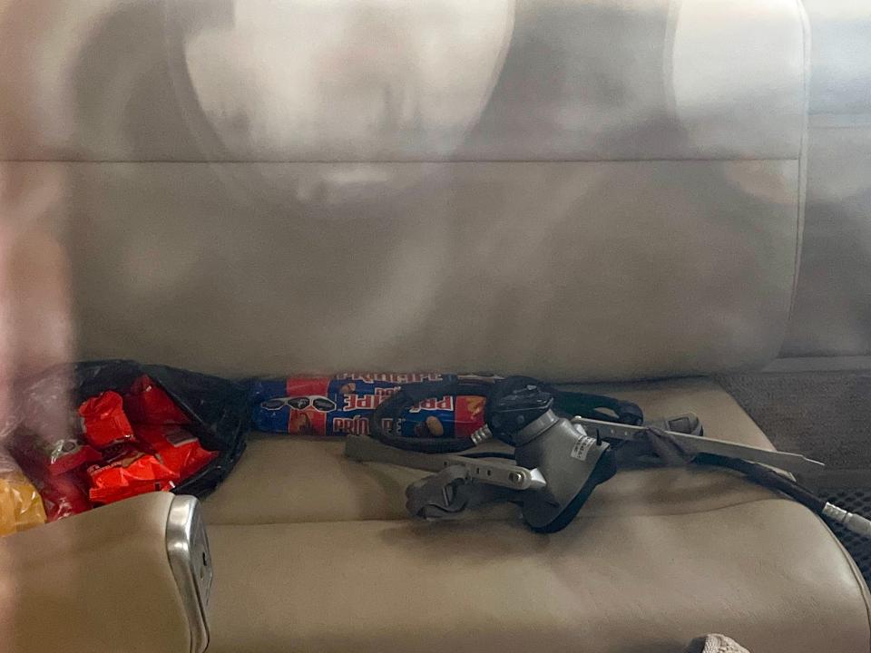 An oxygen mask and snacks rest on a seat inside the Beechcraft jet that landed at Dona Ana County International Jetport in Santa Teresa, New Mexico on Thursday, July 25, 2024, with Ismael "El Mayo" Zambada on board.