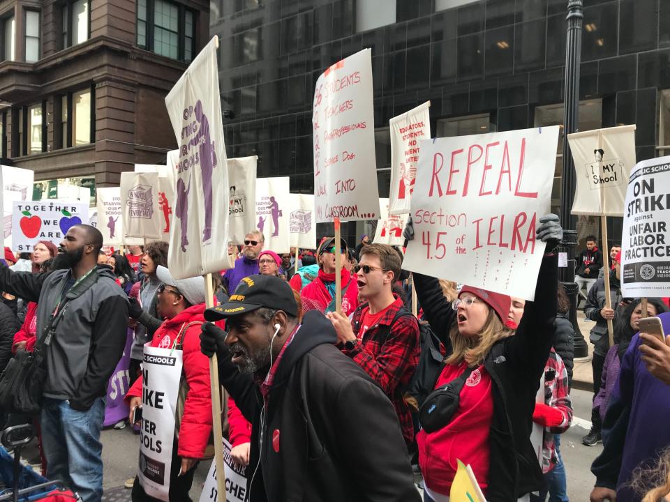 Striking Chicago Public Schools teachers and supporters rally in front of CPS headquarters in downtown Chicago on Thursday, Oct. 17, 2019. (Abel Uribe/Chicago Tribune via AP)