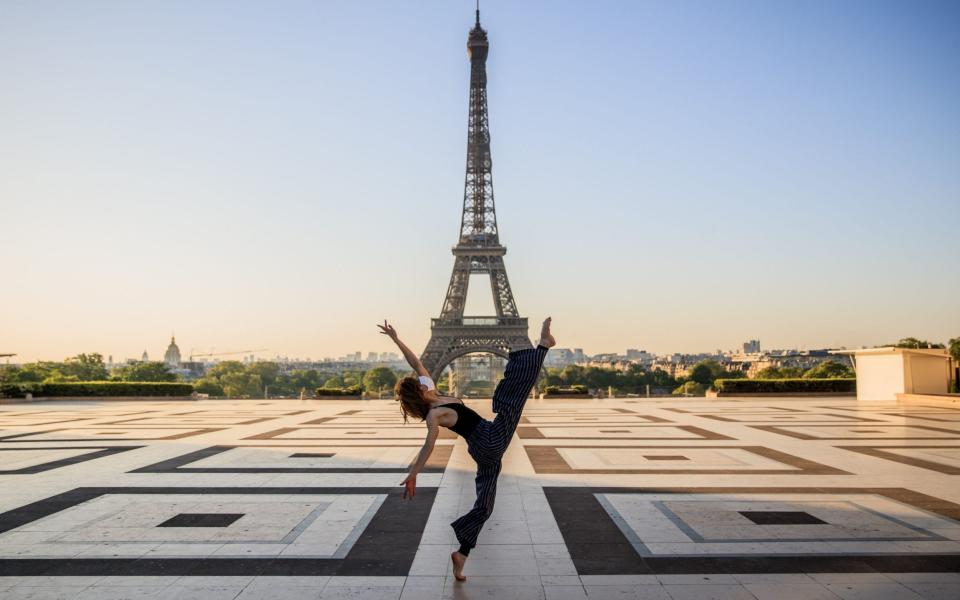 Syrian dancer and choreographer Yara al-Hasbani performs a dance on the empty Trocadero square in front of the Eiffel tower - Sameer Al-Doumy/AFP